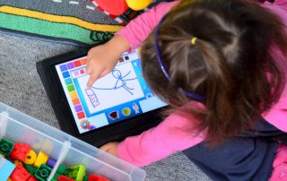 little-girl-plays-with-touch-screen-computer.jpg